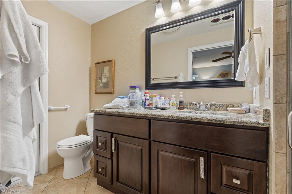 View of Westside Ensuite Designer Tiled Bathroom of Granite Vanity w/Designed Vanity Hardware, New MOEN Faucets both Sink and Shower and Huge Framed Mirrow