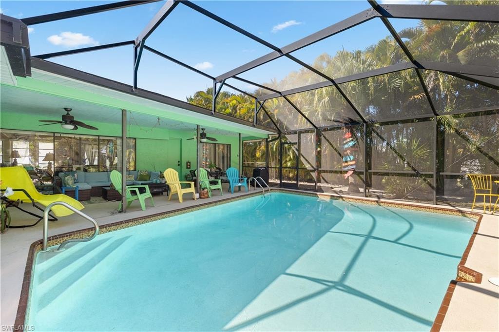 View of Pool with New Screened Pool Cage and Lanai/Outdoor Dining w/Newly Installed Water Timing Systems for both Pool and Spa]