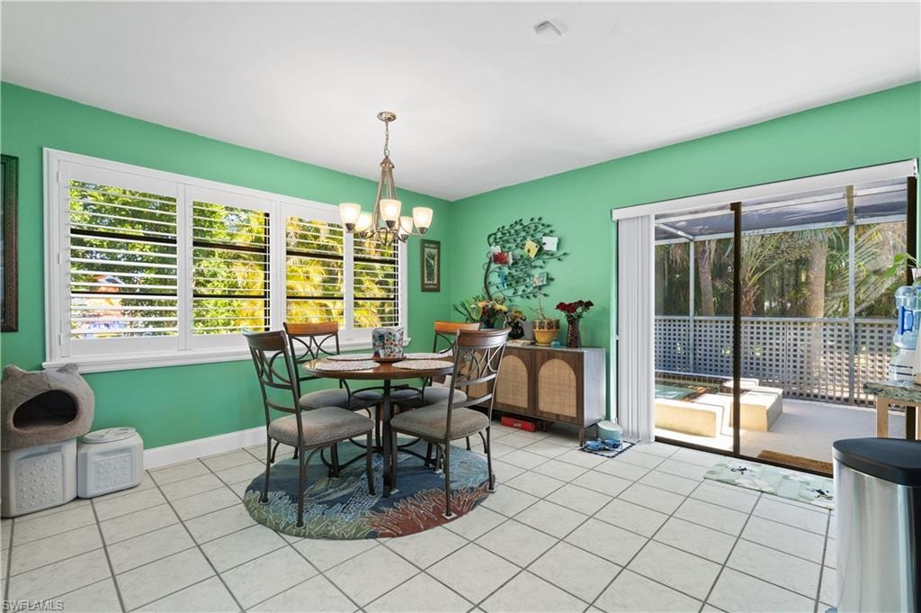 View of the attractive Dining Toom with Custom Installed Plantation Shuttered Windows to Back Yard . . . and Slider to the Separate Private Spa.