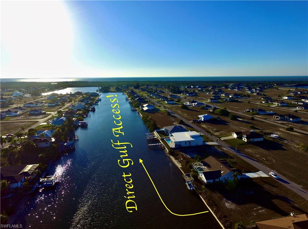 Aerial perspective of suburban area with a large body of water