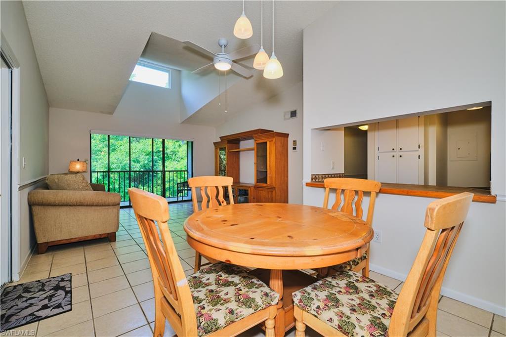 The dining area features tile floors, fresh paint.