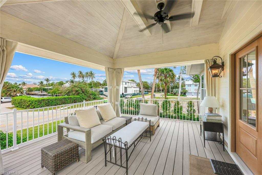 Deck featuring an outdoor living space and ceiling fan