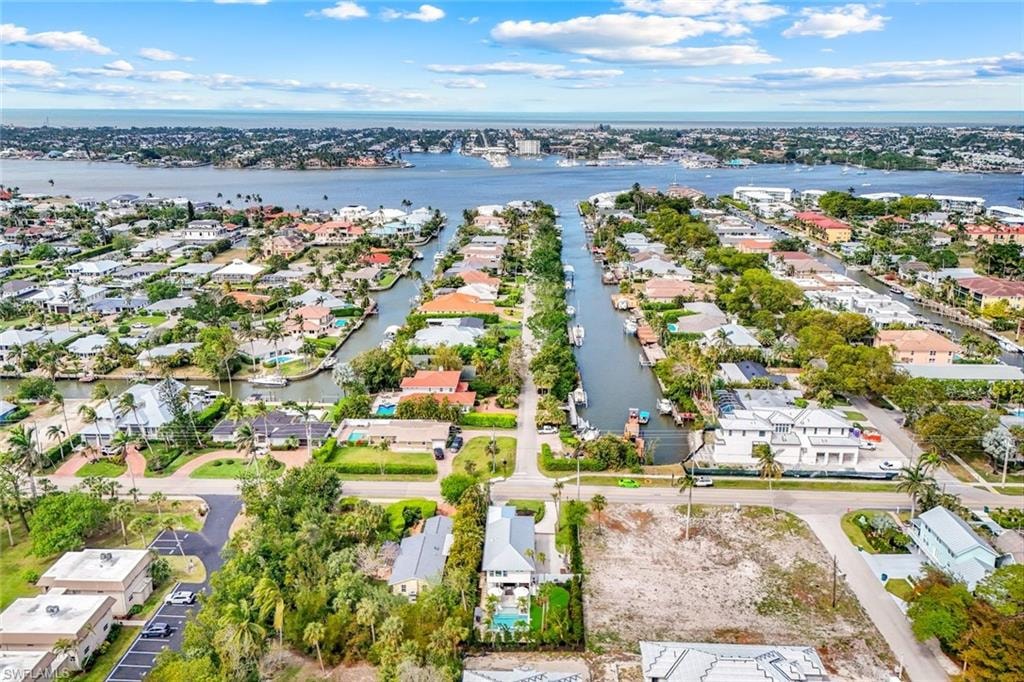 Aerial view with a residential view and a water view