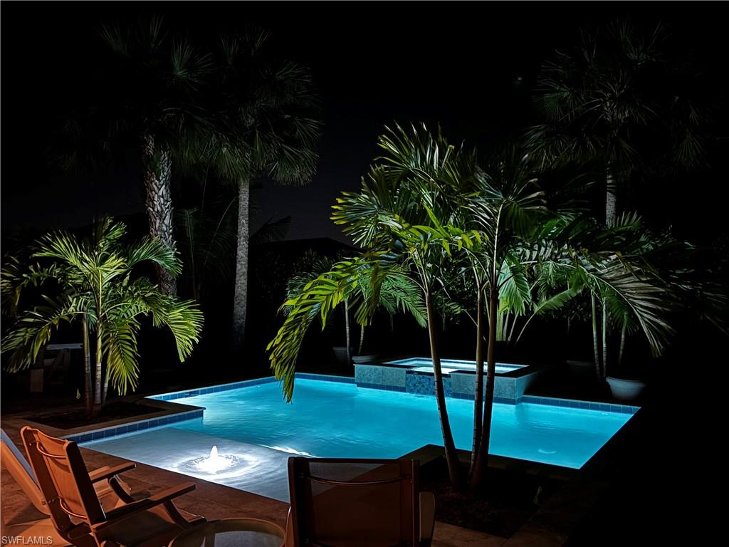 View of pool featuring a pool with connected hot tub