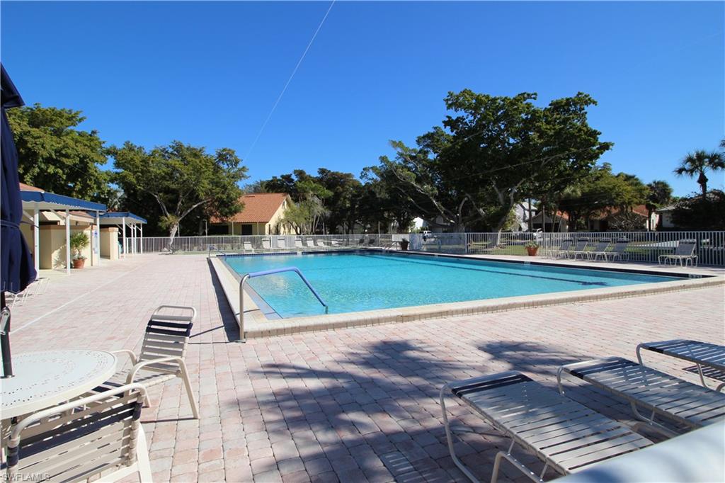 Community pool with a patio area.