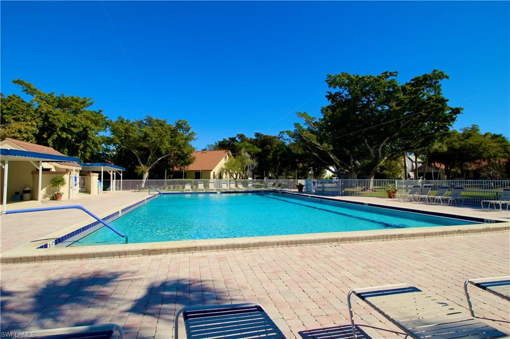 Community pool with large patio area, shuffleboard courts and restrooms