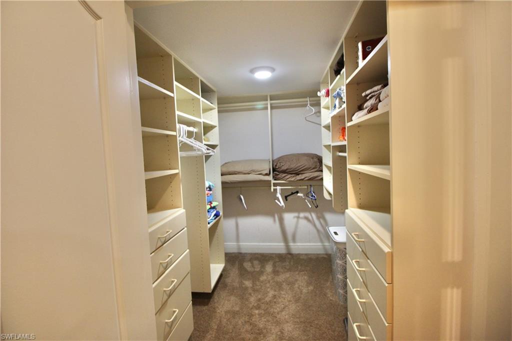 Custom walk in closet off of master bedroom