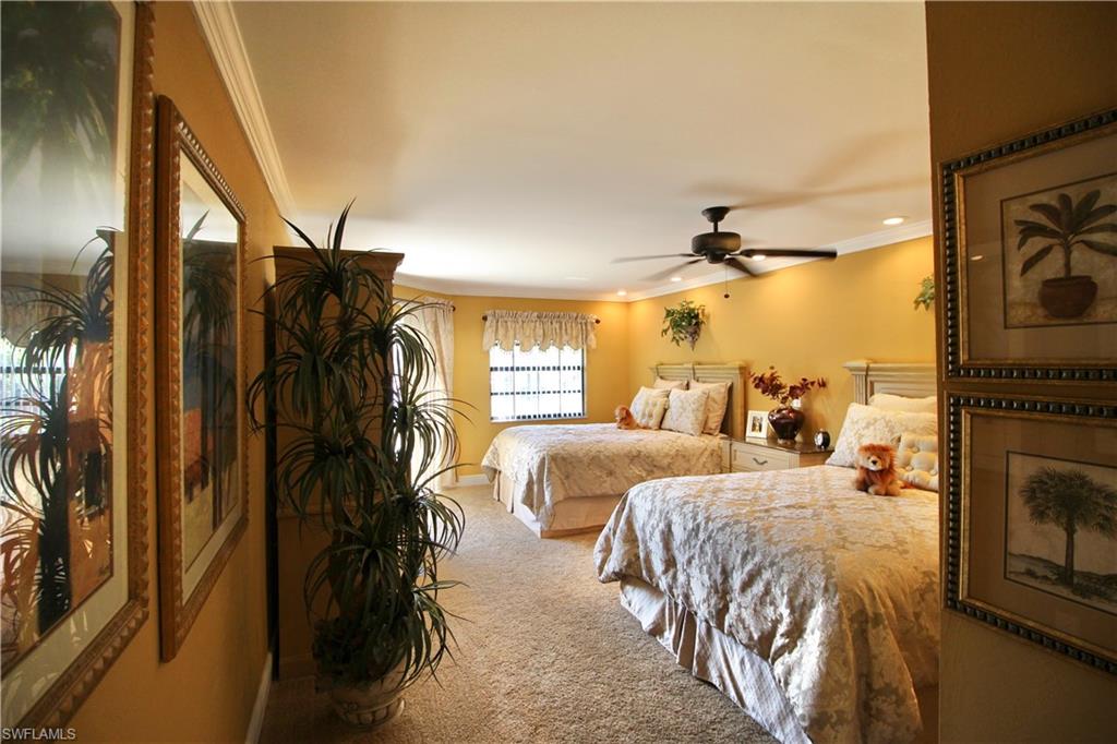 Large master bedroom with private screened lanai and crown molding