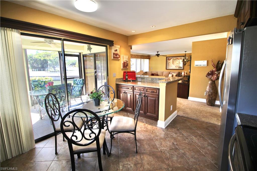 Large eat in kitchen overlooking screened in lanai