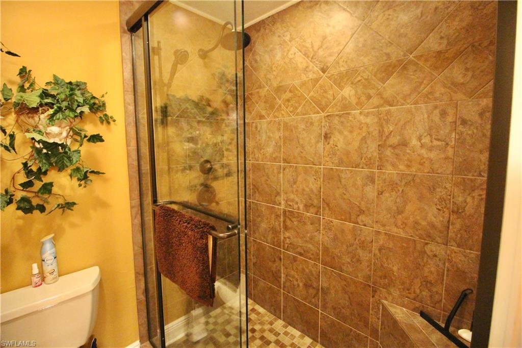 custom tiled walk in shower in master bath