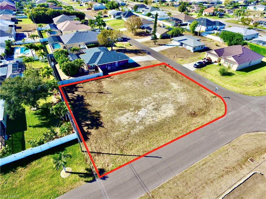 Aerial perspective of suburban area with property boundaries highlighted