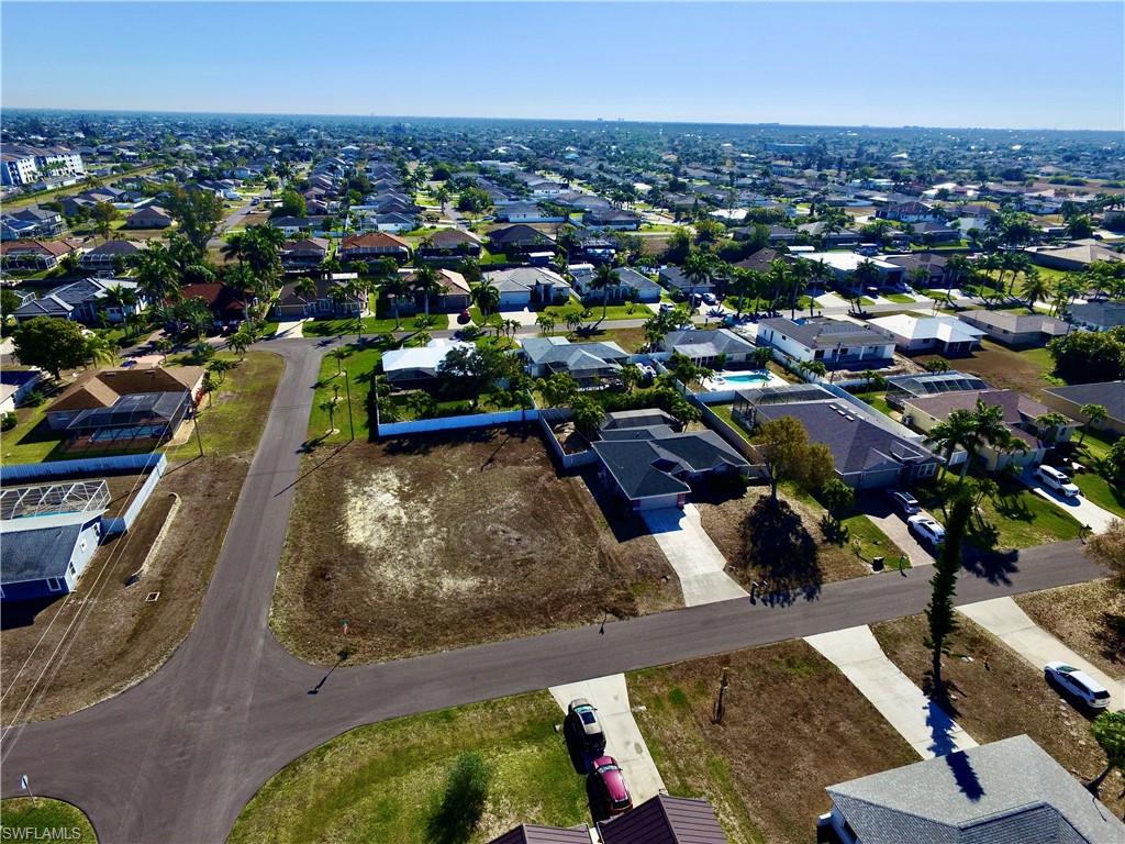 Aerial overview of property's location with nearby suburban area