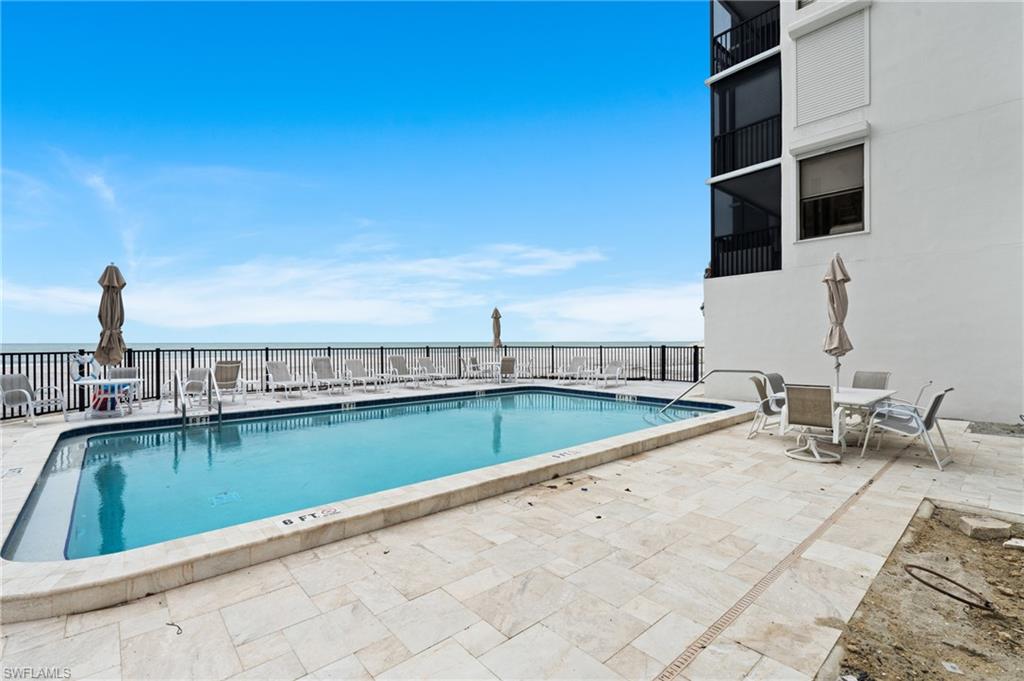 Community pool featuring a patio area
