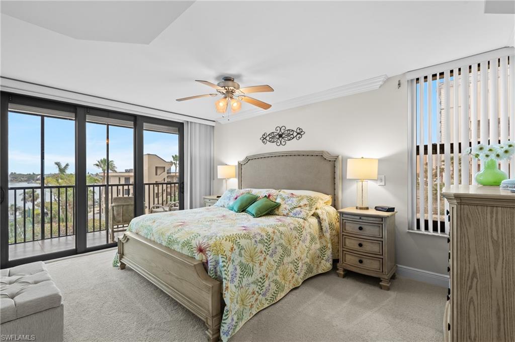 Bedroom featuring light carpet, access to outside, a ceiling fan, and crown molding