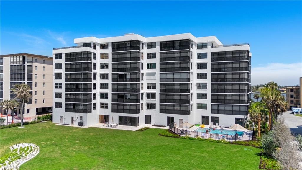 View of apartment building / complex with a community pool
