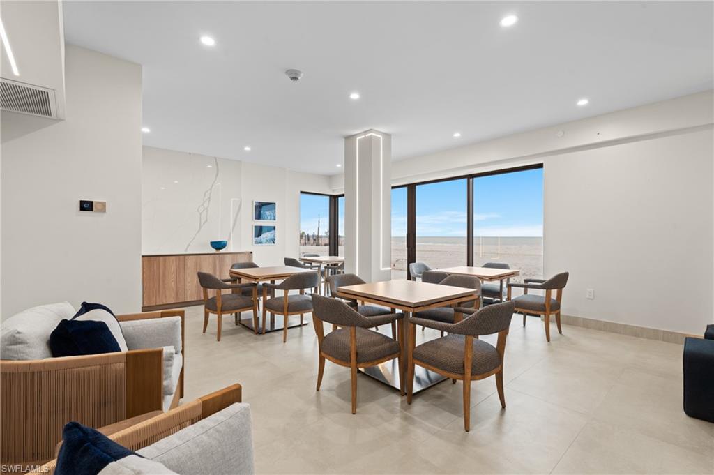 Dining room with recessed lighting and baseboards