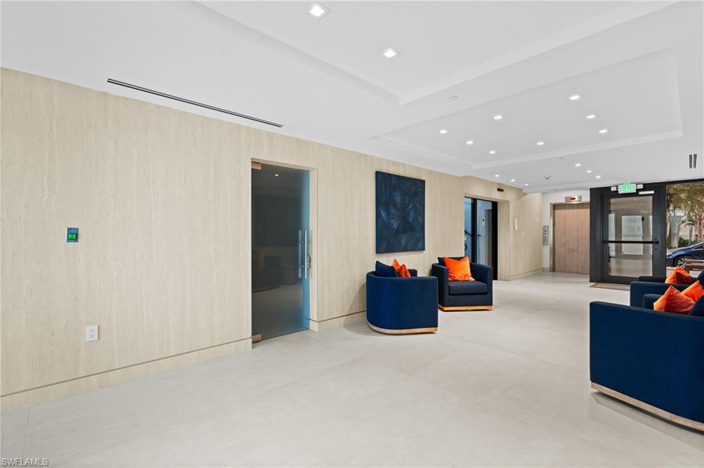 Lobby featuring recessed lighting and a raised ceiling