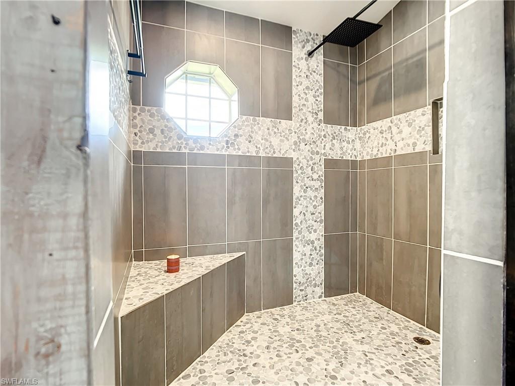 Bathroom featuring tiled shower