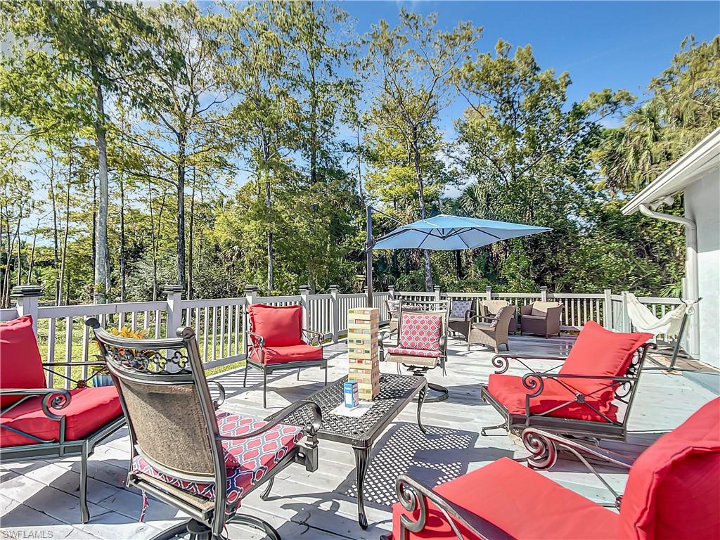 View of patio featuring outdoor lounge area and a deck