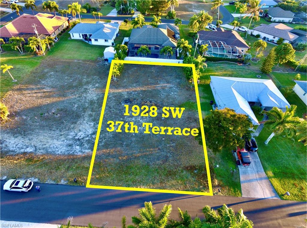 Aerial perspective of suburban area with property parcel outlined