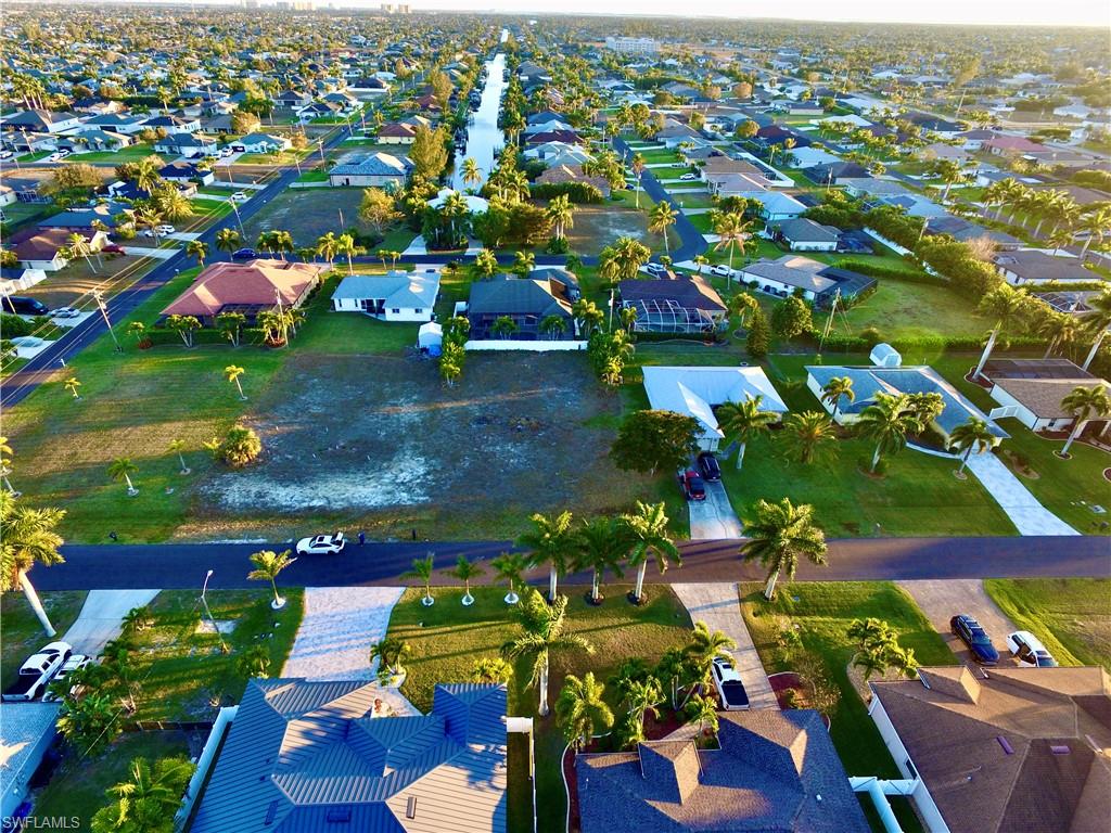 Aerial overview of property's location featuring nearby suburban area
