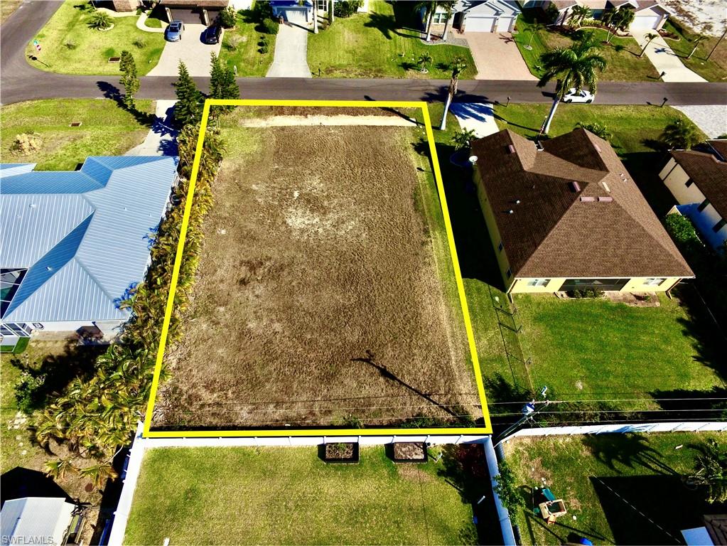 Aerial perspective of suburban area featuring property boundaries highlighted