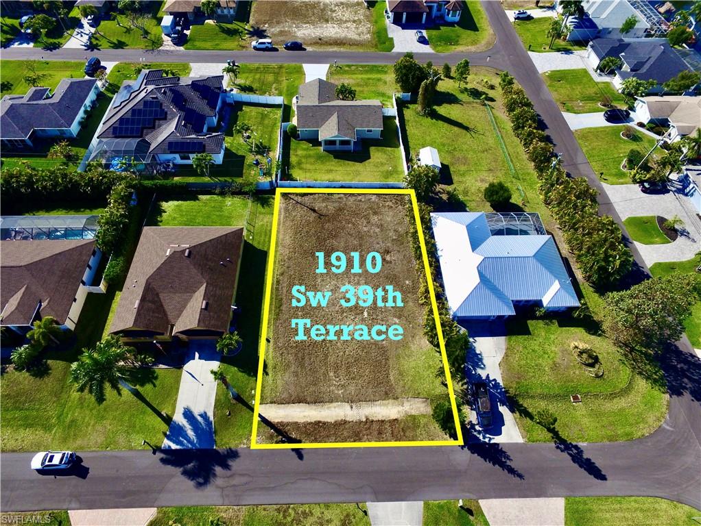 Aerial perspective of suburban area featuring property boundaries highlighted