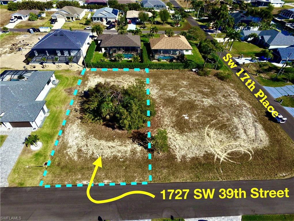Aerial view of residential area with property parcel outlined