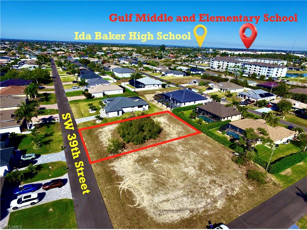Aerial view of residential area featuring property boundaries highlighted