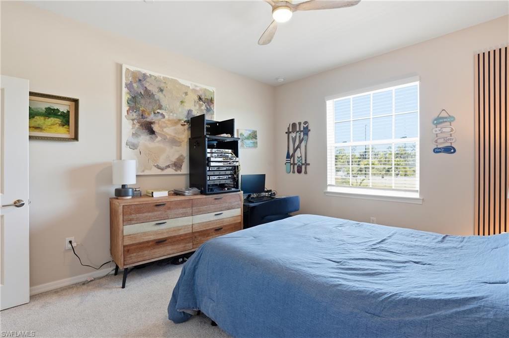 Bedroom with carpet and a ceiling fan