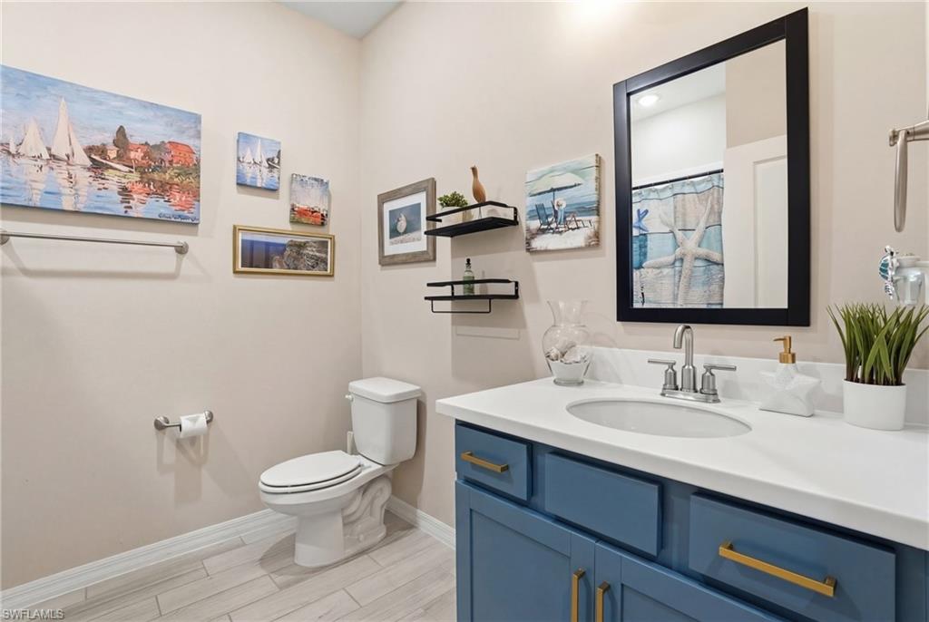 Bathroom with vanity and curtained shower