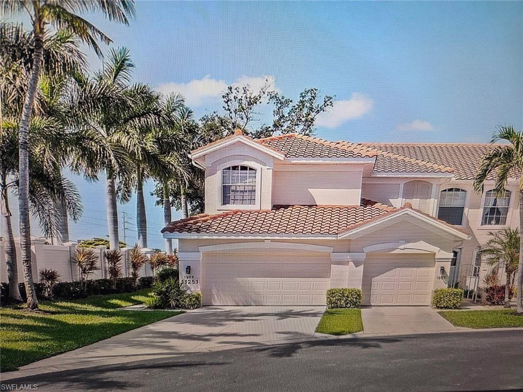 Mediterranean / spanish home with a tiled roof, concrete driveway, and stucco siding