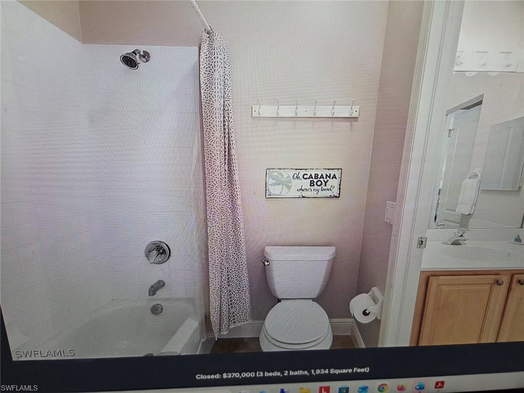 Full bathroom with vanity and shower / tub combo