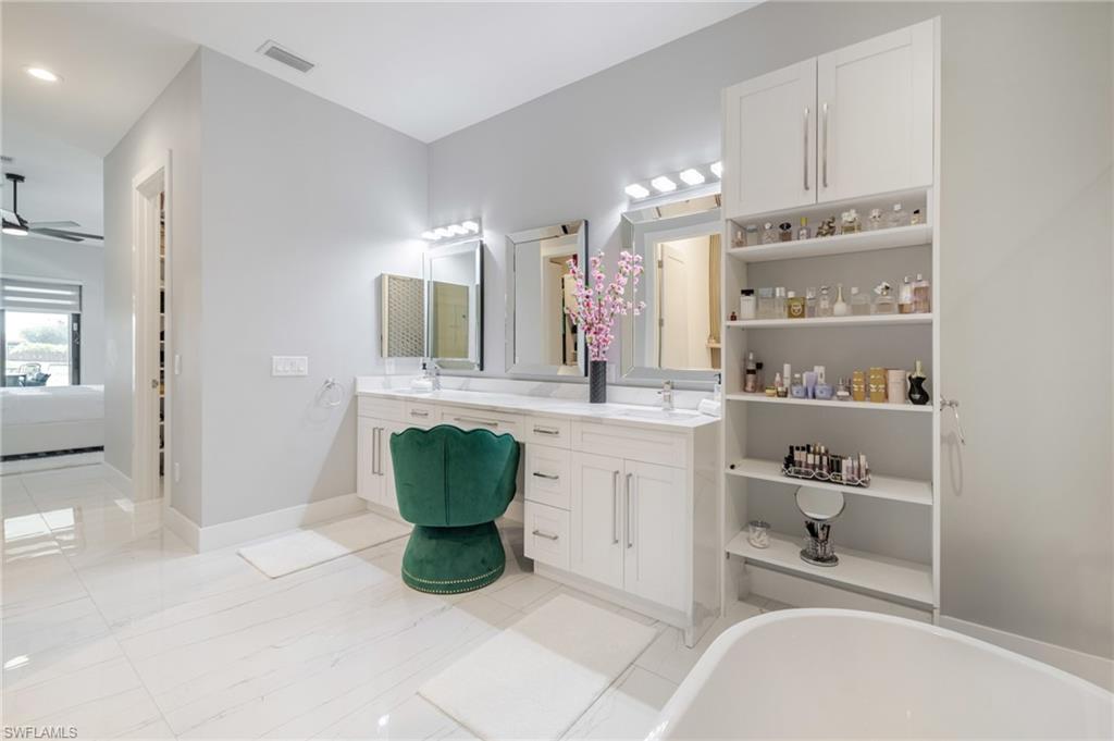 Ensuite bathroom with double vanity and a soaking tub