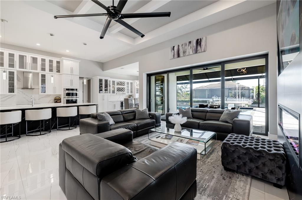 Living room featuring ceiling fan and recessed lighting