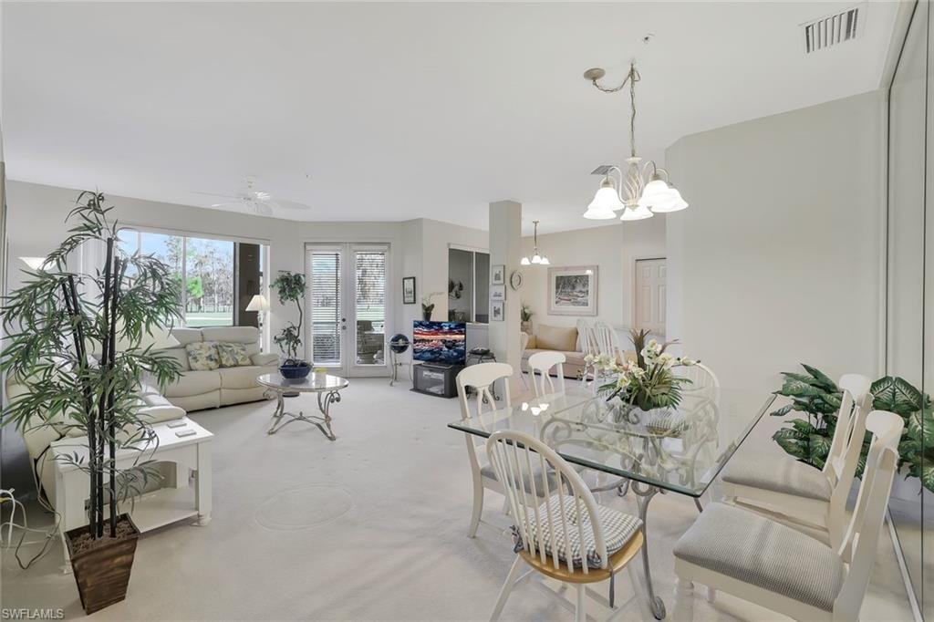 Dining room featuring a ceiling fan and hanging lights