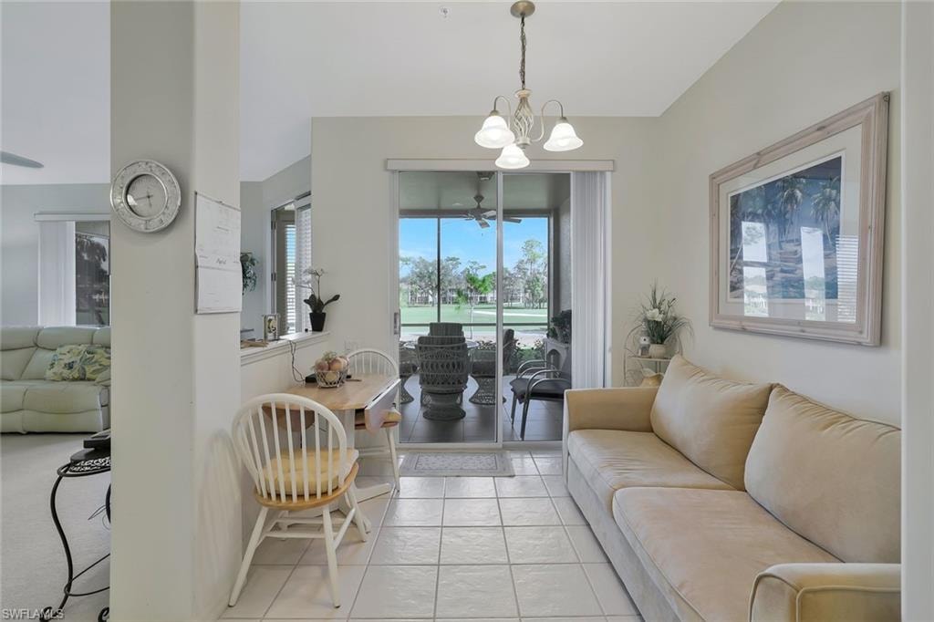 Living room featuring a chandelier and light tile patterned floors