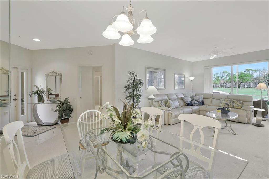 Dining room featuring ceiling fan and a chandelier
