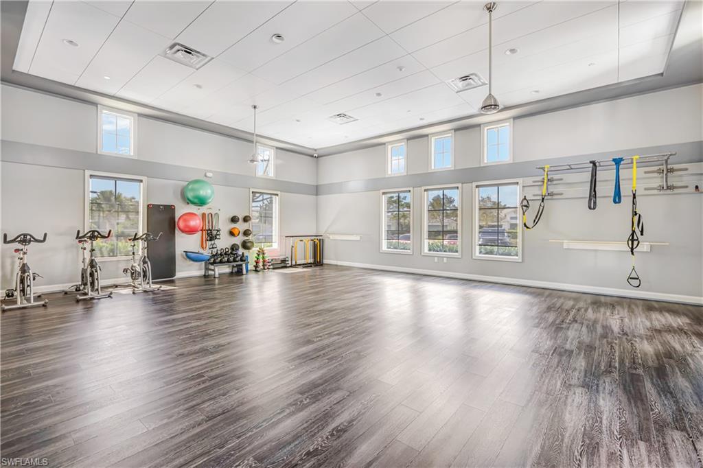 Gym featuring a high ceiling