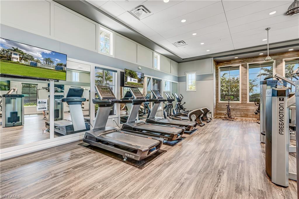 Exercise room featuring recessed lighting