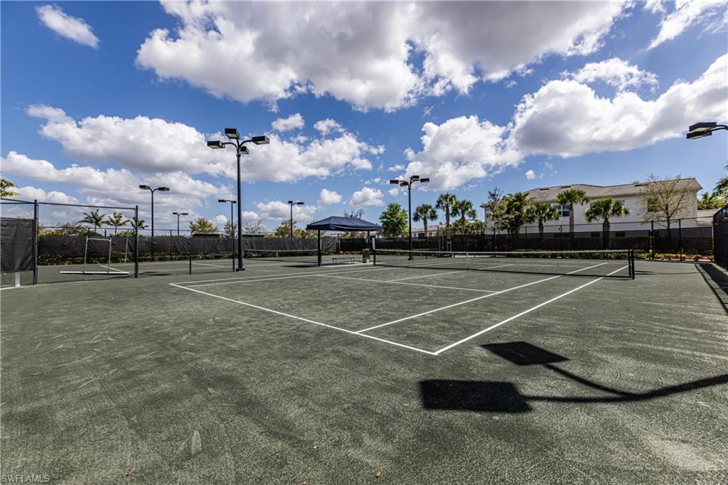 View of tennis court featuring a gazebo