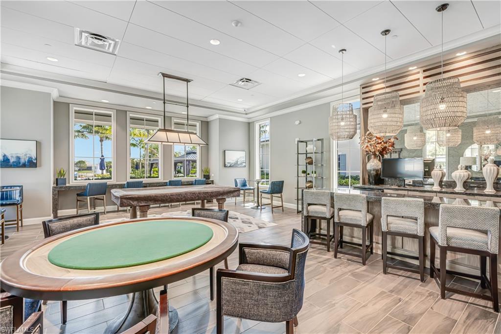 Rec room with crown molding and pool table