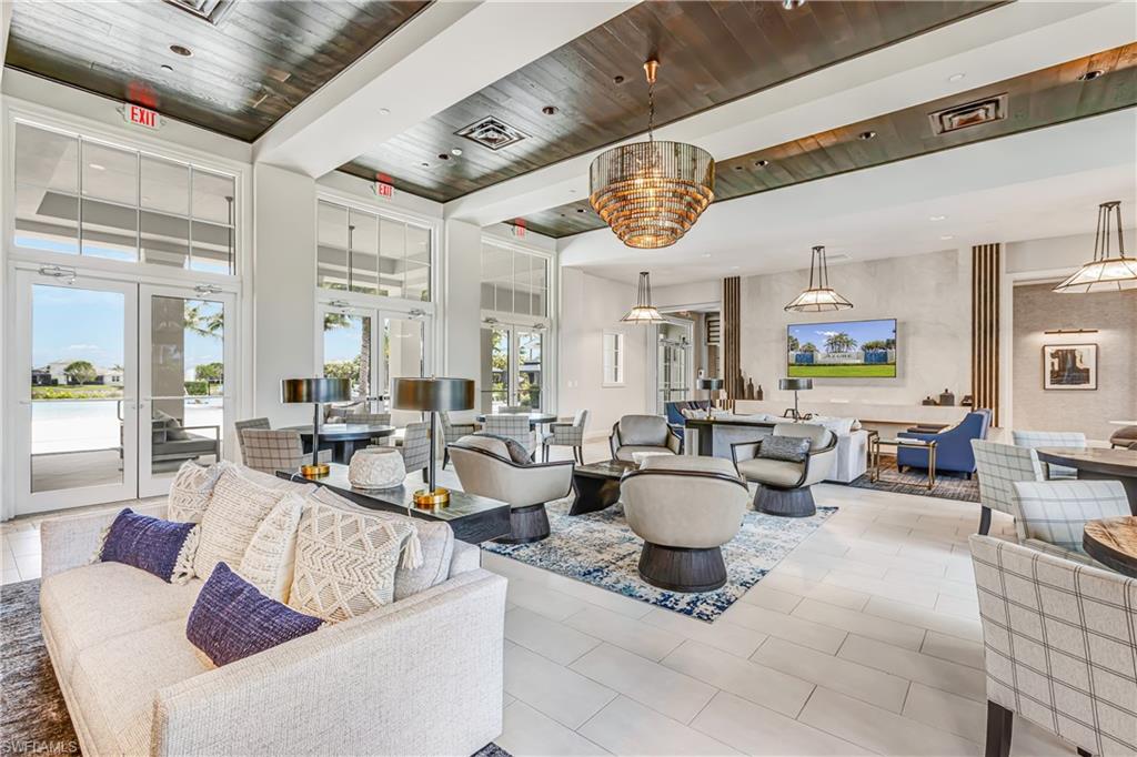 Lobby featuring a wood ceiling with exposed beams and recessed lighting