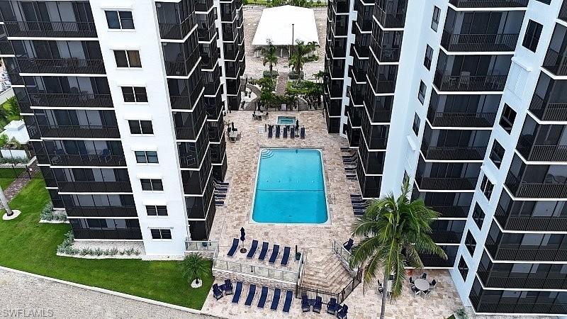 Aerial view of apartment complex / building and a pool area