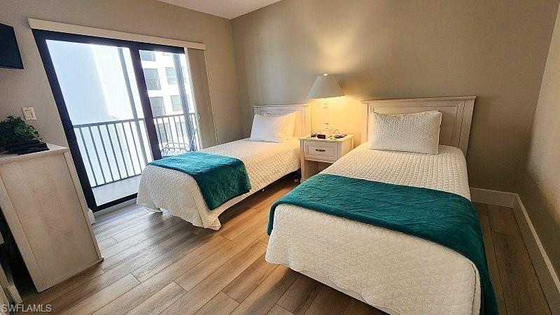 Bedroom featuring light wood-style flooring and access to exterior