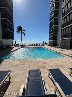 Community pool with a patio area