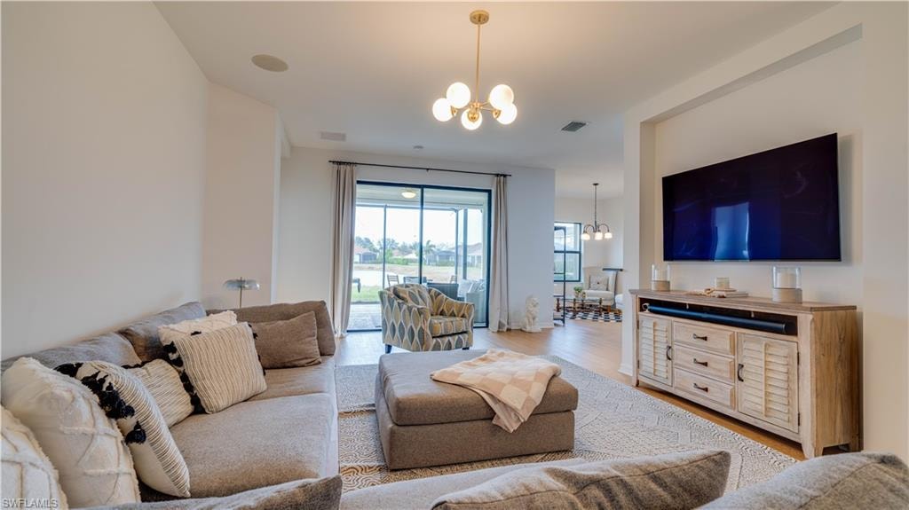 Living room with a chandelier and wood finished floors