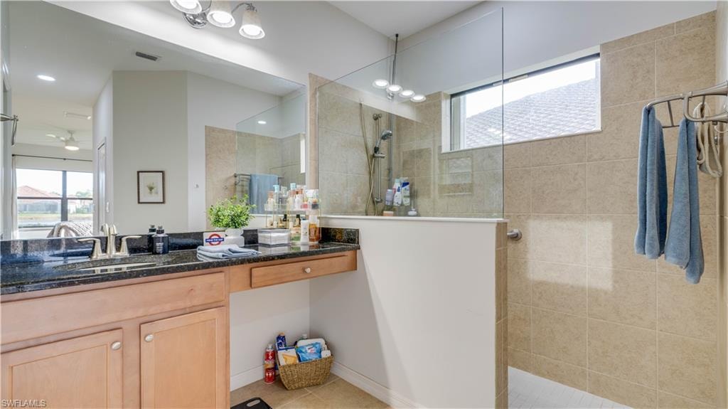 Full bath with vanity and a walk in shower