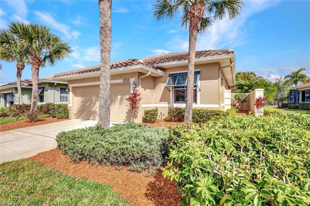 Mediterranean / spanish home with an attached garage, stucco siding, concrete driveway, and a tiled roof