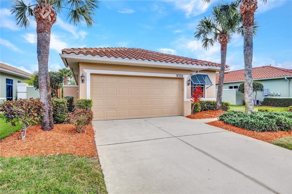 Mediterranean / spanish home featuring stucco siding, concrete driveway, a tiled roof, and an attached garage